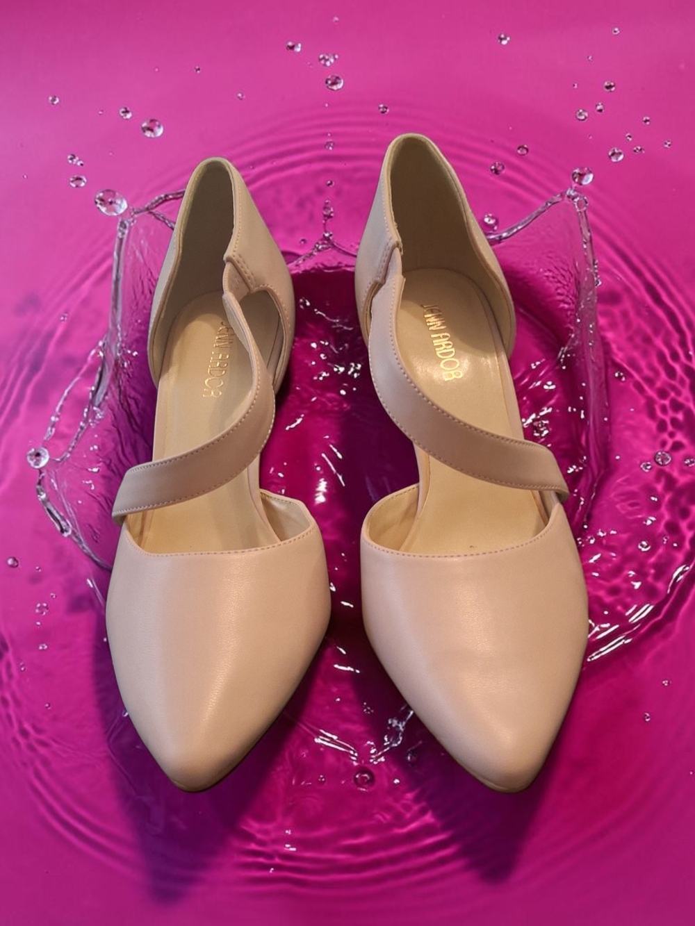 Jenn Ardor nude pointed-toe heels feature a unique asymmetrical strap design.